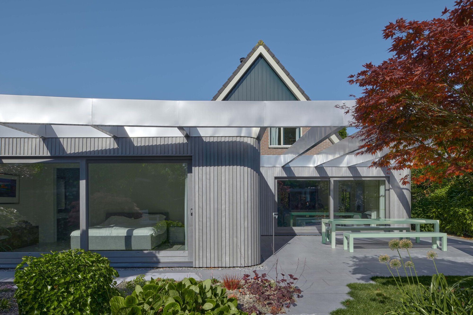 Sustainable Home Renovation with Timber Cladding: AR House by Atlas Architecture