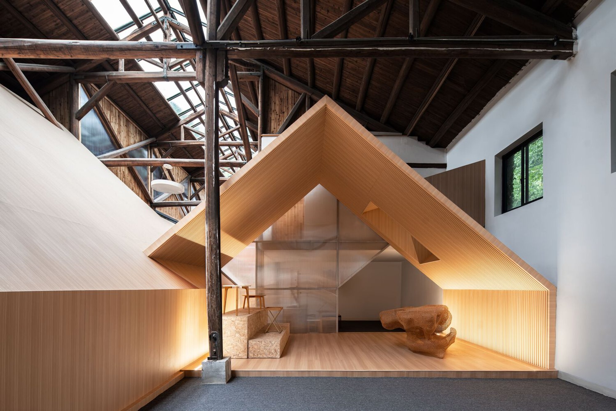 Warehouse Renovation Architecture: Transforming Industrial Spaces with "Warehouse within a Warehouse" Media Center