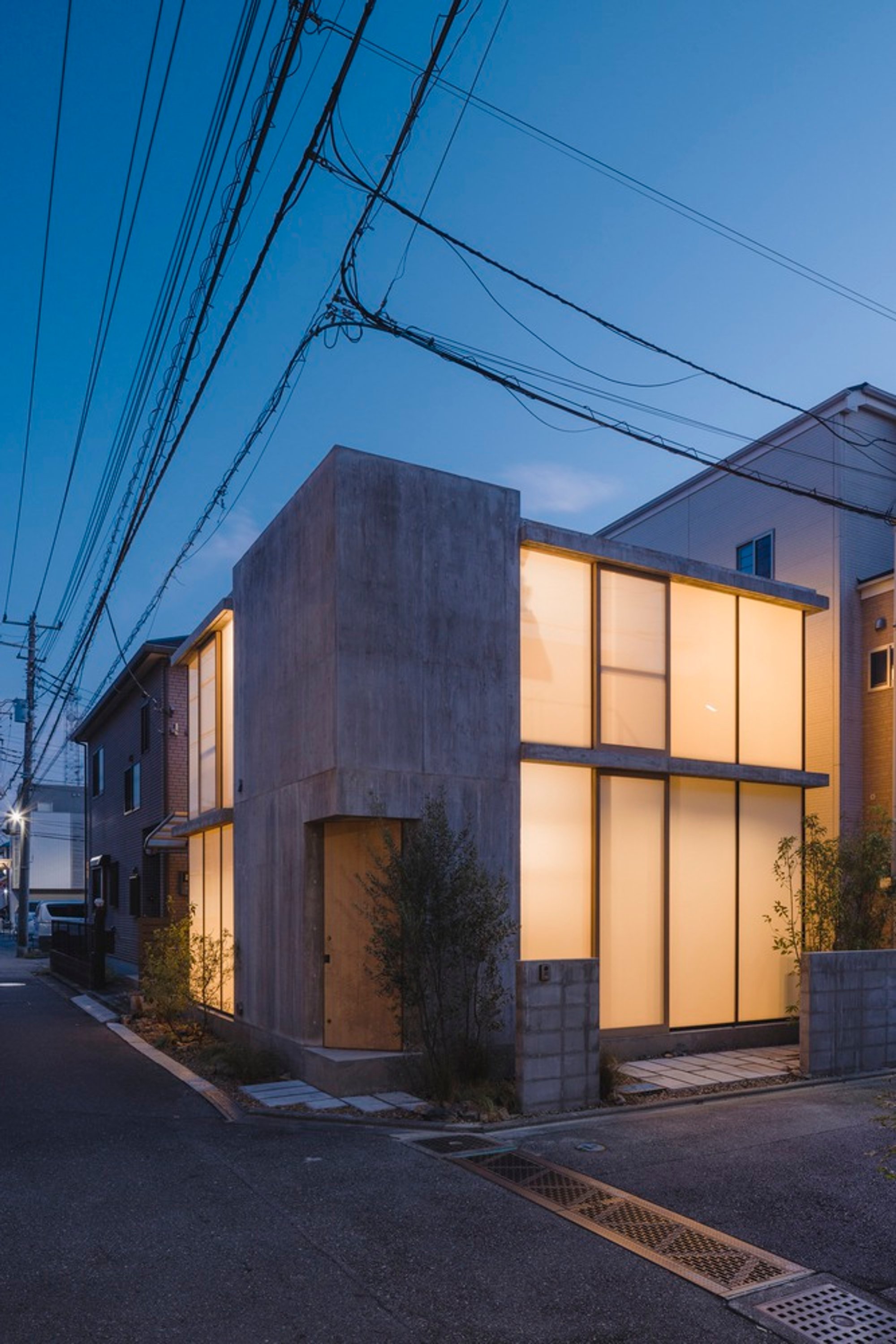 Modern Cantilevered House Design: A Deep Dive into IGArchitects' Check Patterned House