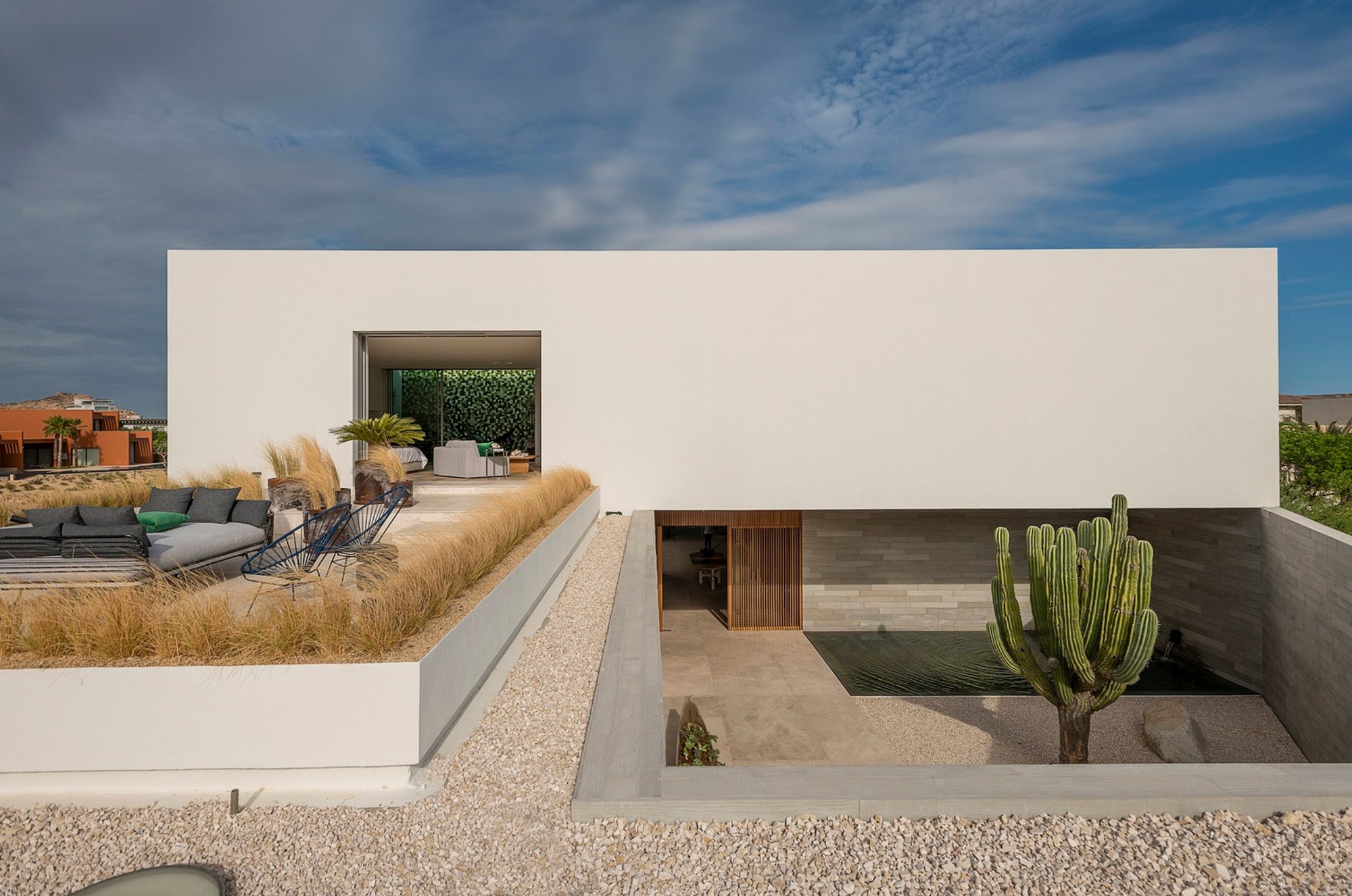 Rammed Earth Architecture in Coastal Homes: IMA House by Ezequiel Farca Studio