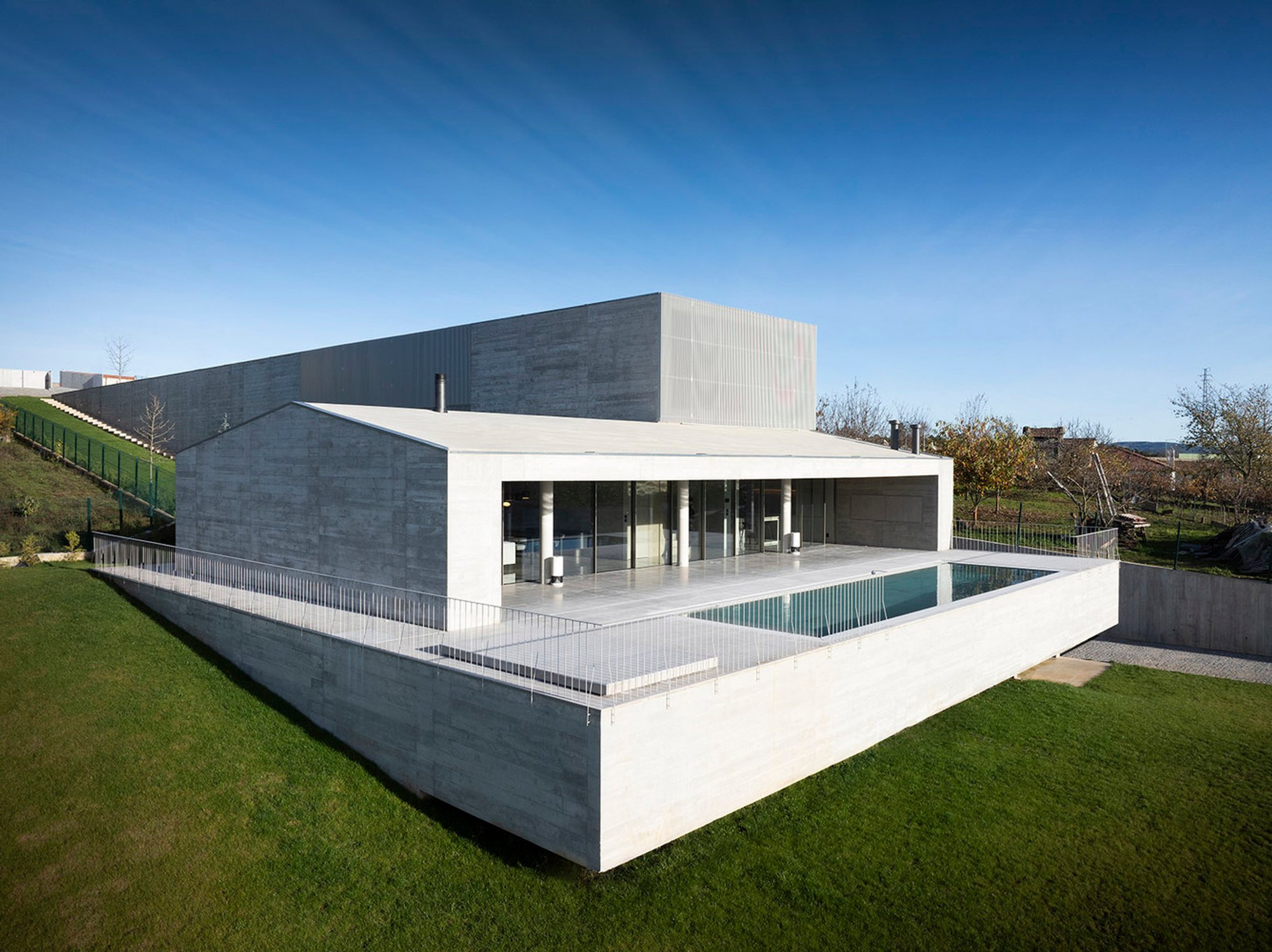 Modern Architecture in Sloped Terrain: House in Vila Real by AZO. Sequeira Arquitectos Associados