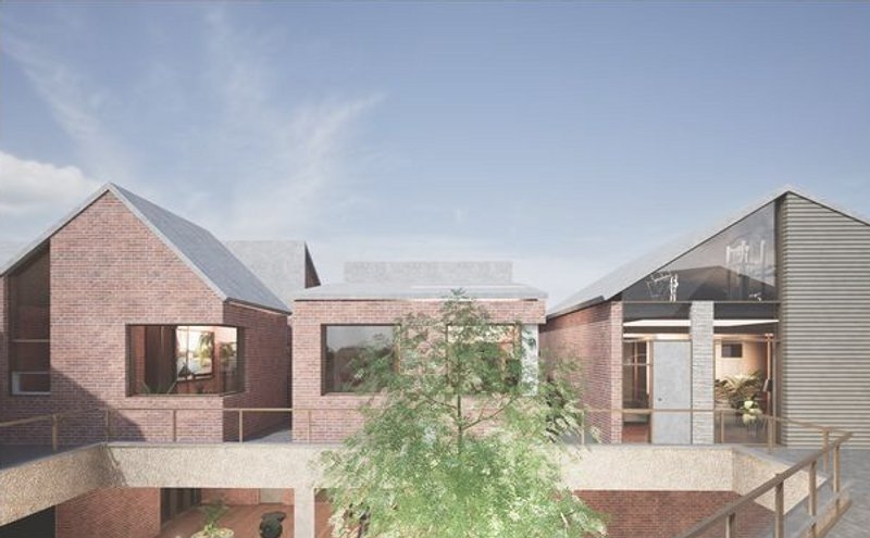 Elevated Harmony: A Blend of Brick, Glass, and Greenery Creating a Modern Community with Traditional Roots.