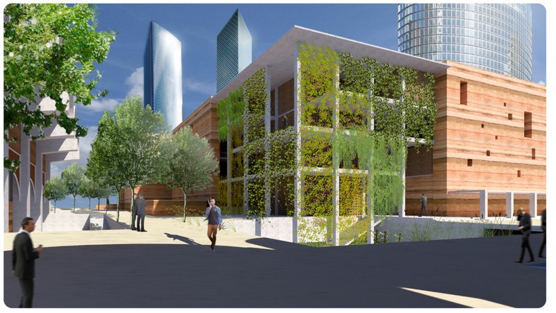 Green facade integrating natural vegetation with rammed earth walls.