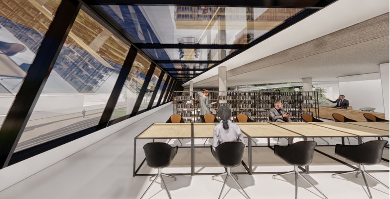 Interior view of the library's study area with floor-to-ceiling glass windows, creating an inspiring learning environment