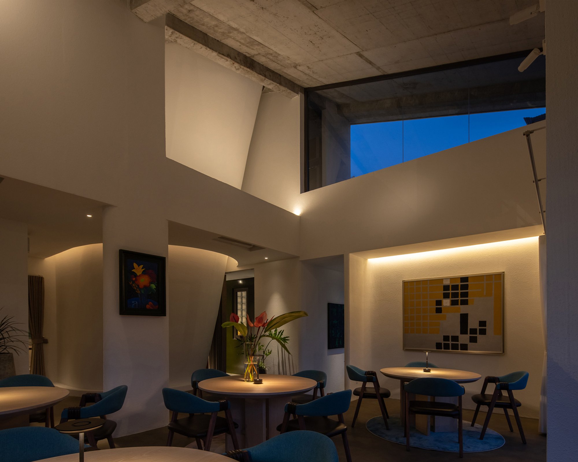 Eigh-T Architects Carves Light Wells and Angled Walls into a Vietnamese Restaurant of Quiet Geometry