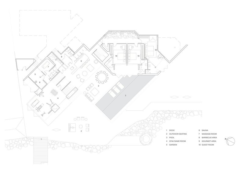Floor plan drawing showing angular rooms arranged around a central courtyard with pool