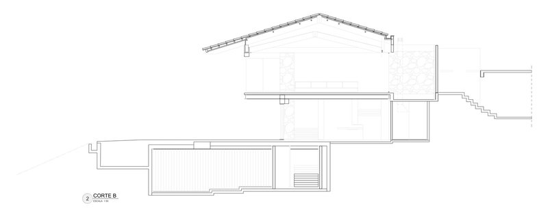 Section drawing revealing split-level volumes with sloped roofs and stepped terrain