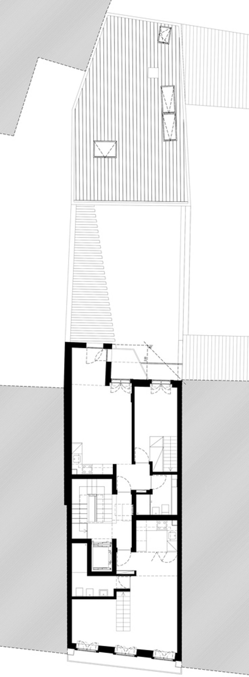 Roof plan drawing depicting corrugated cladding patterns and skylights across the narrow residential volumes