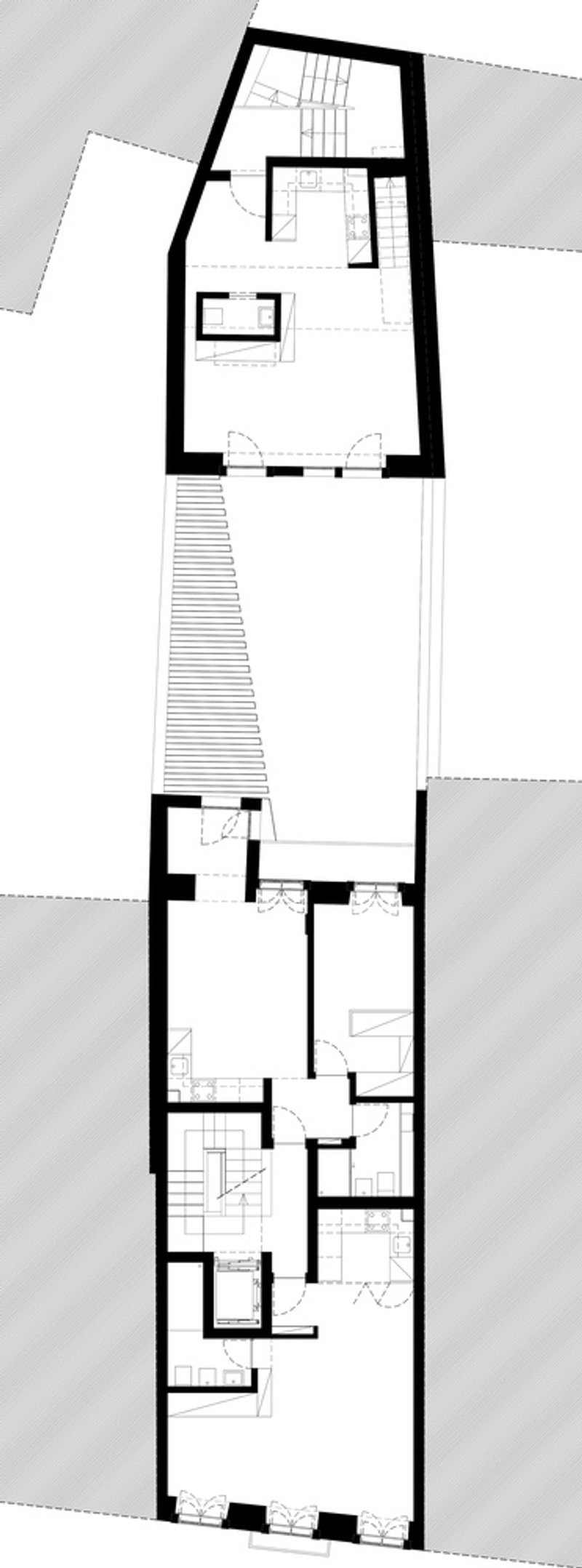 Floor plan drawing showing upper level with open space and skylight above courtyard