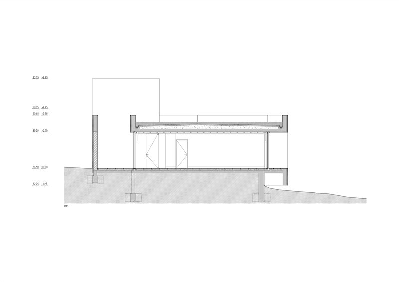 Section drawing showing timber roof structure with exposed joists over interior volumes and sloping grade