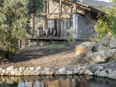SO? Architecture and Ideas Splits a Turkish Hillside House Between Stone and Timber