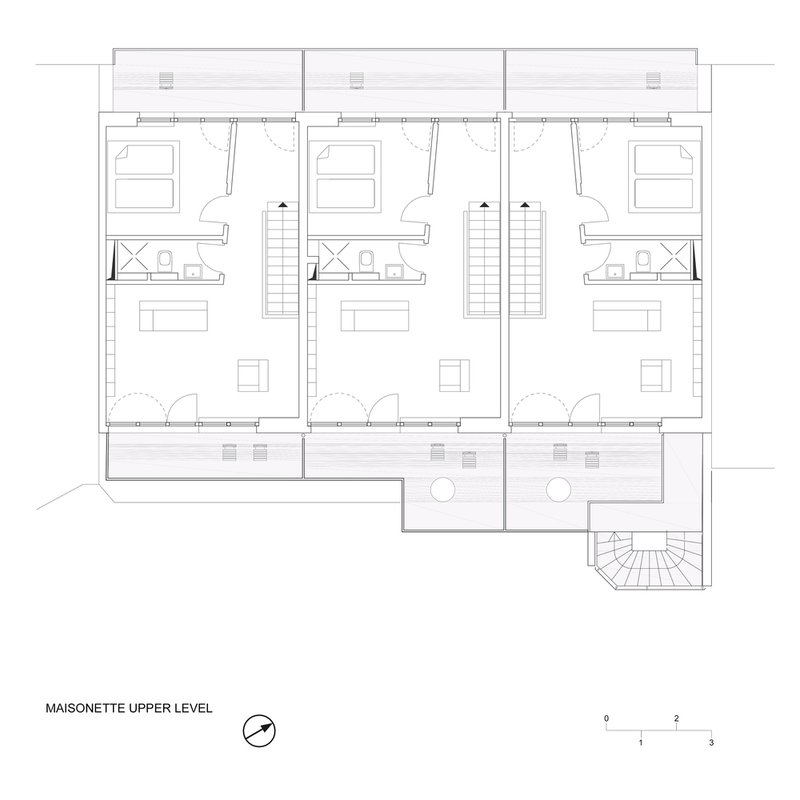 Floor plan drawing of three maisonette units with double-height spaces and staircases