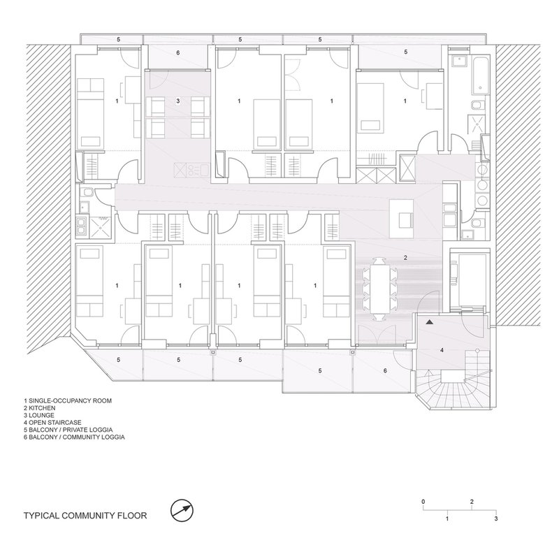 Floor plan drawing of a community floor with single-occupancy rooms surrounding a central lounge