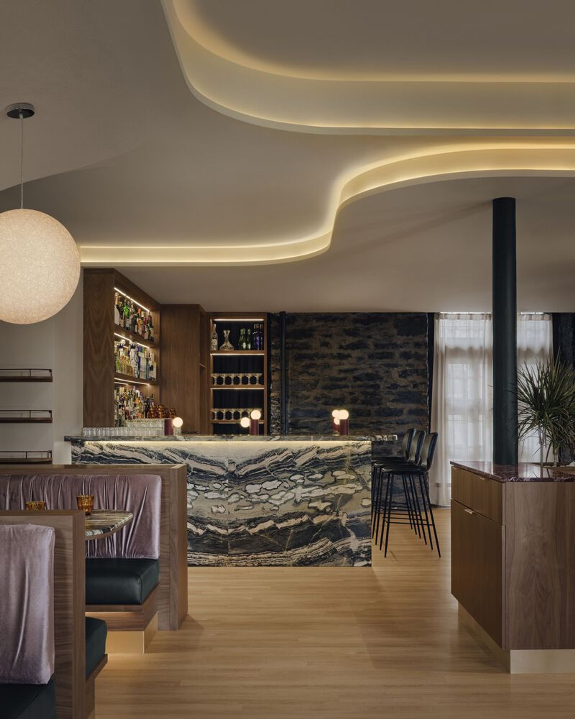 Ivy Studio Wraps a Montreal Restaurant in Sculptural Layers of Marble, Fabric, and Light