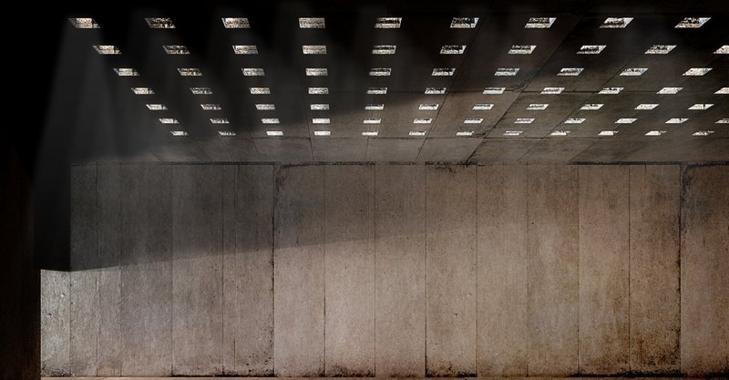 A dramatic play of light through perforated ceilings in the Museum of Memory, symbolizing hope and resilience.