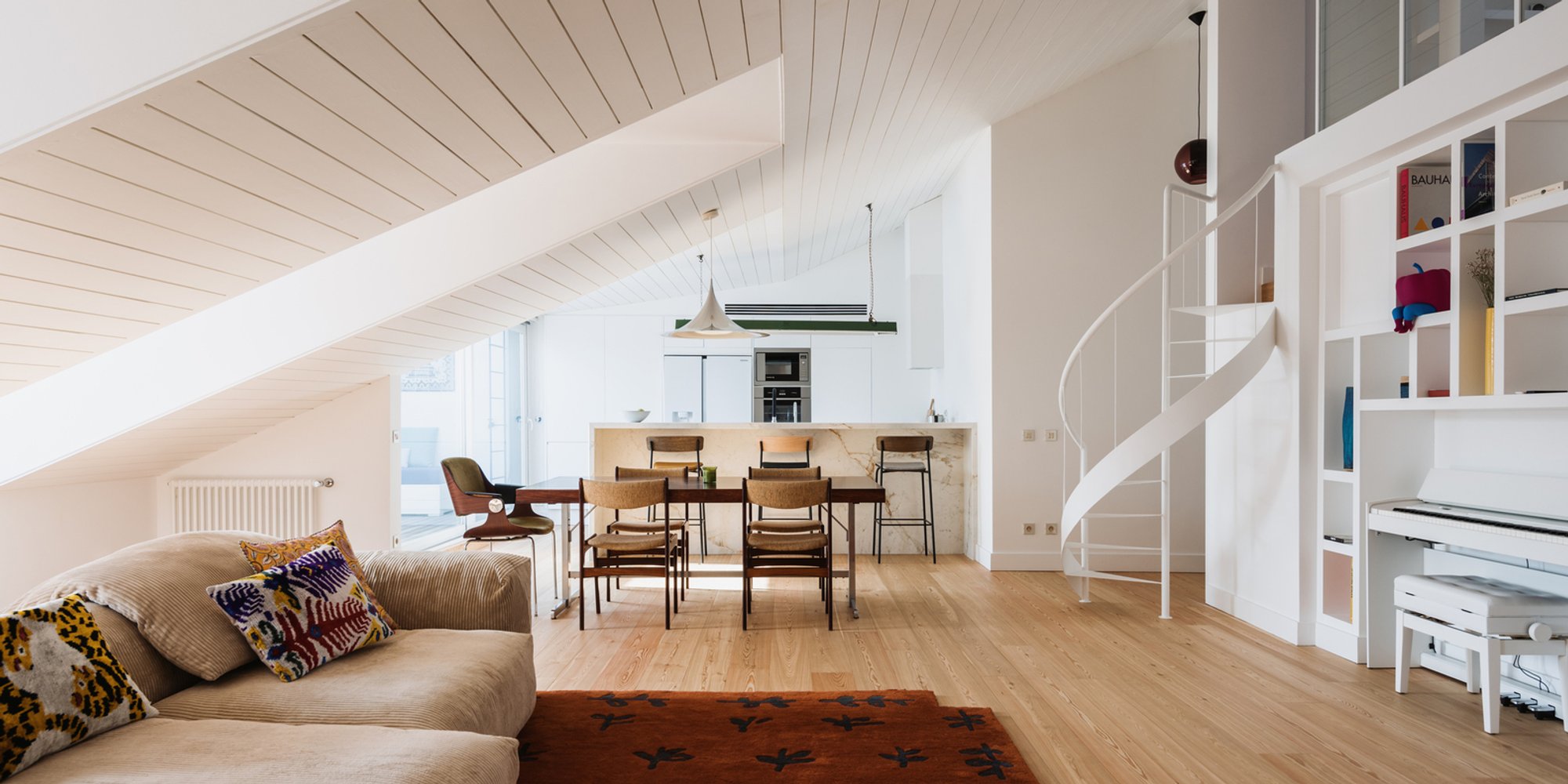 X Atelier Carves a Double-Height Home out of a Lisbon Rooftop