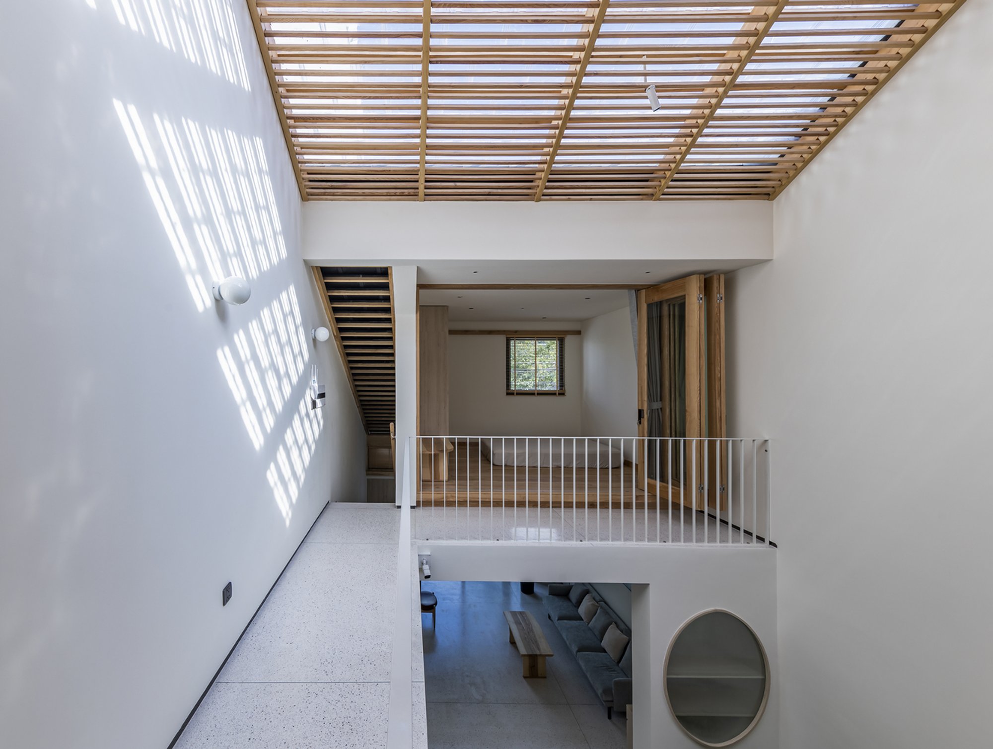 Thien Hung Stacks Domestic Life Under a Slatted Timber Skylight in Southern Vietnam