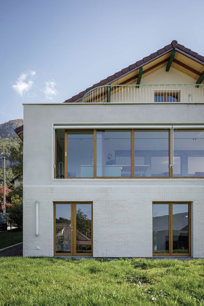 Garden side vertical: white brick and timber window detail, lawn approach