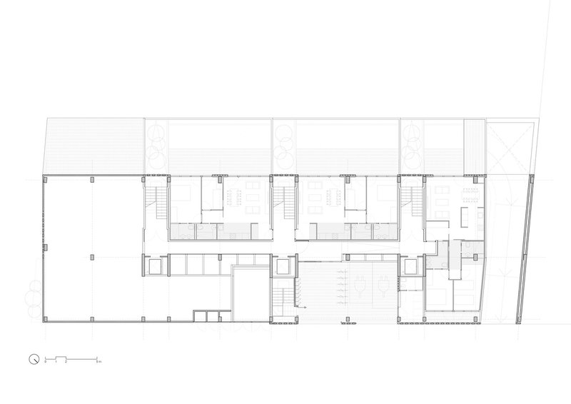 Ground-floor plan: commercial and common spaces at the front, residential units and terraces at the rear, two stair cores