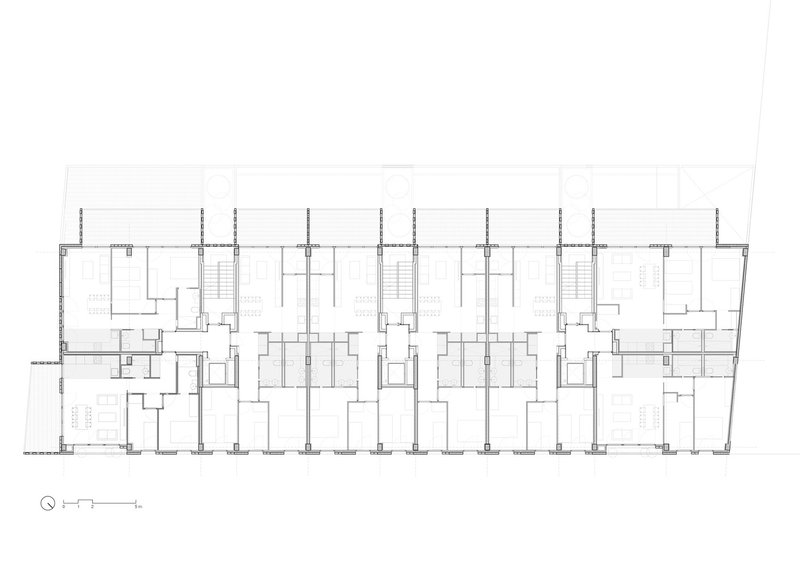 Typical floor plan: seven dwelling units per floor arranged along a central corridor, balconies on the south-west facade, two stair cores