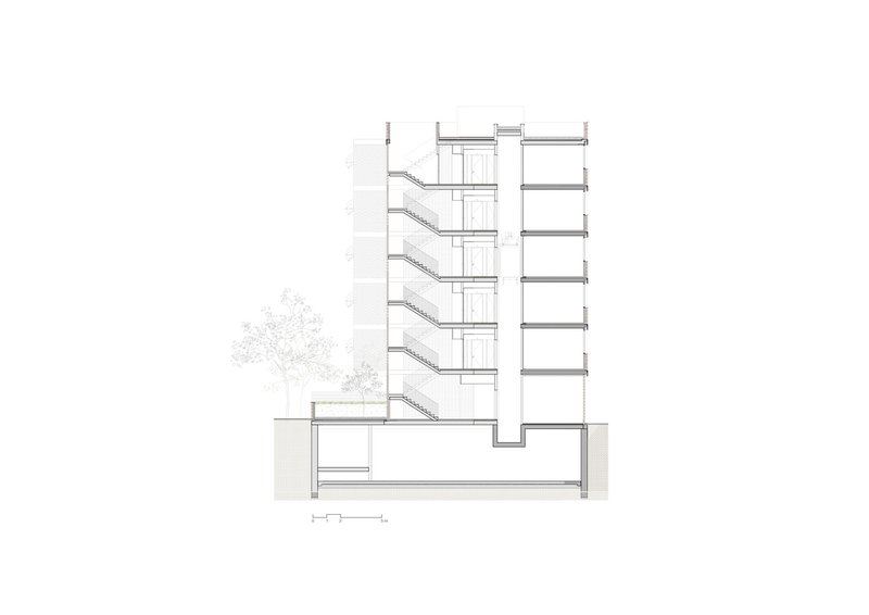 Cross section: basement parking, ground-floor lobby, five residential levels stepping back at the top, stair and lift core at centre