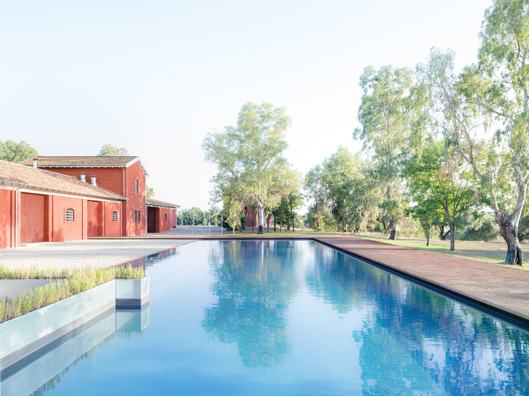 SUPERVOID Transforms a Roman Agricultural Estate into a Red-Washed Retreat Among Olive Groves