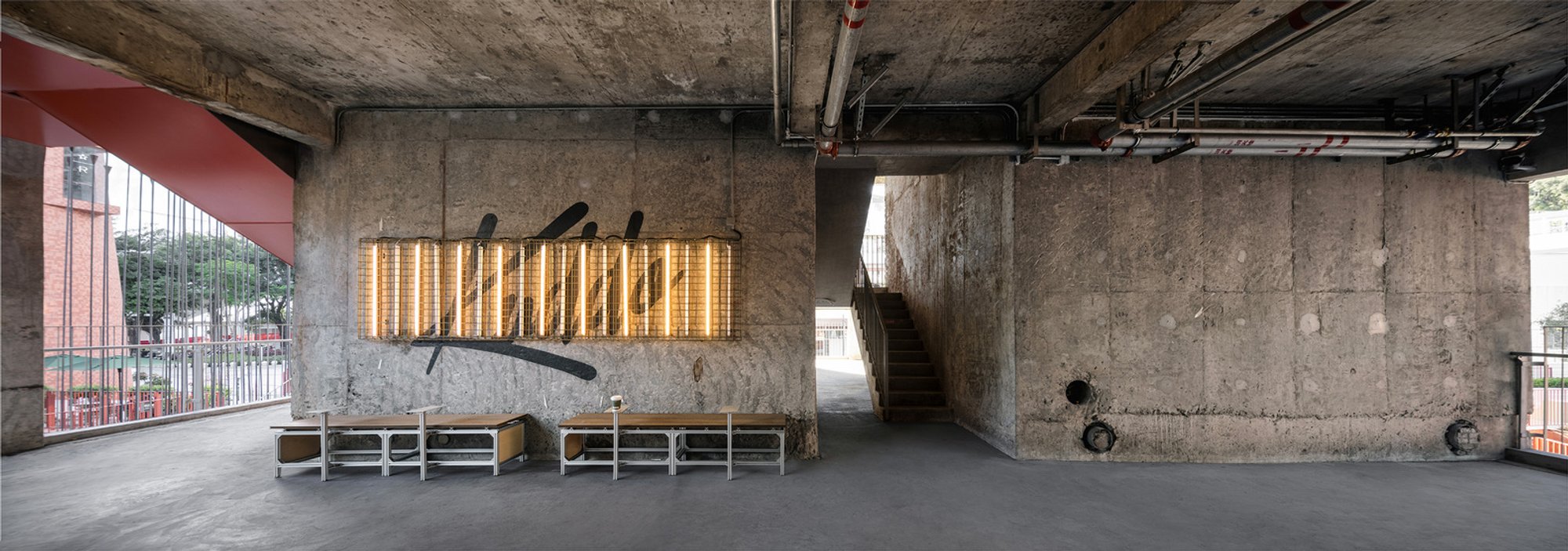Xushi Design Carves a Coffee Sanctuary from Raw Concrete Beneath a Chinese High-Rise Podium