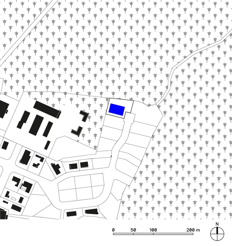 Site plan showing a building highlighted in blue surrounded by tree symbols and road curves