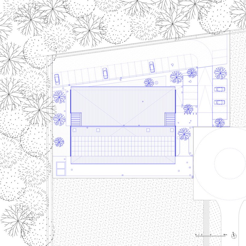 Roof plan drawing showing a pitched volume over a gridded courtyard surrounded by trees