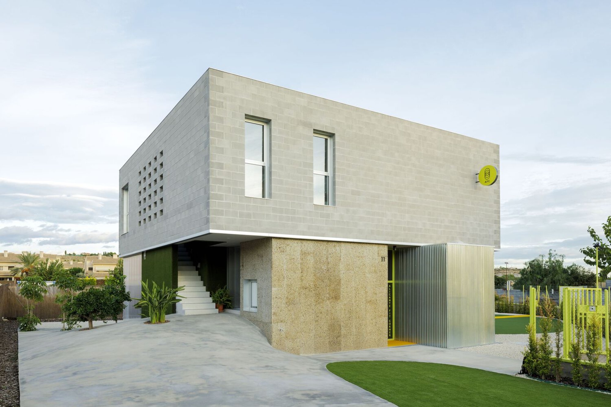 Impepinable Studio Fuses a Gym and a House into One Playful Concrete Block Volume