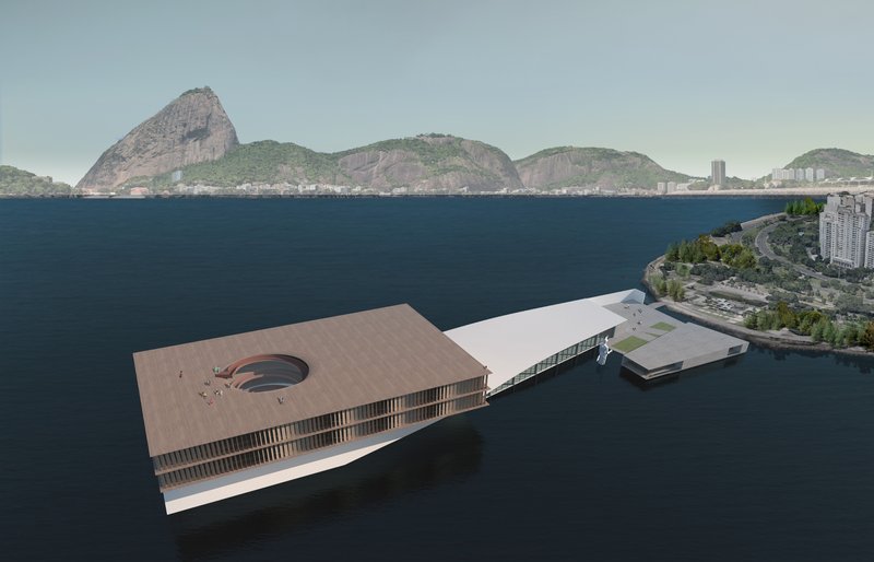 Closer view of the museum’s contemporary design, with glass curtain walls reflecting the ocean’s serenity.