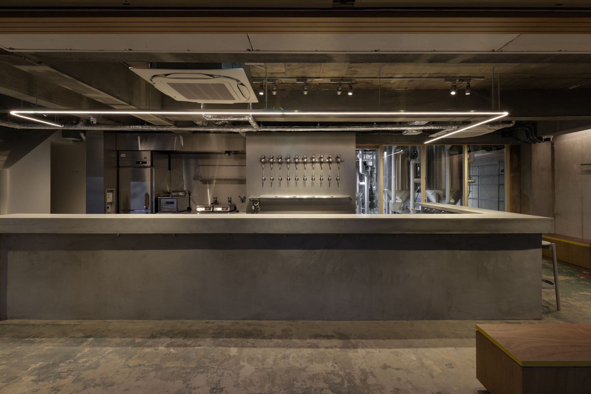 Hidenori Tsuboi Architects Turns an Osaka Rail Overpass into a Craft Brewery That Opens Onto the Street