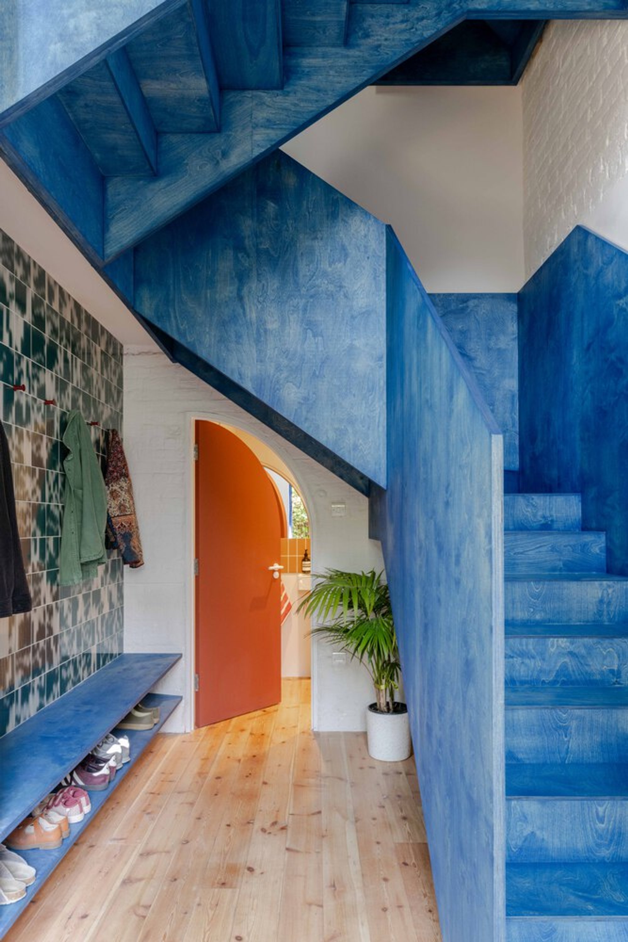 Foils Reinvents a Victorian Coach House in Peckham Around a Blue Plywood Staircase