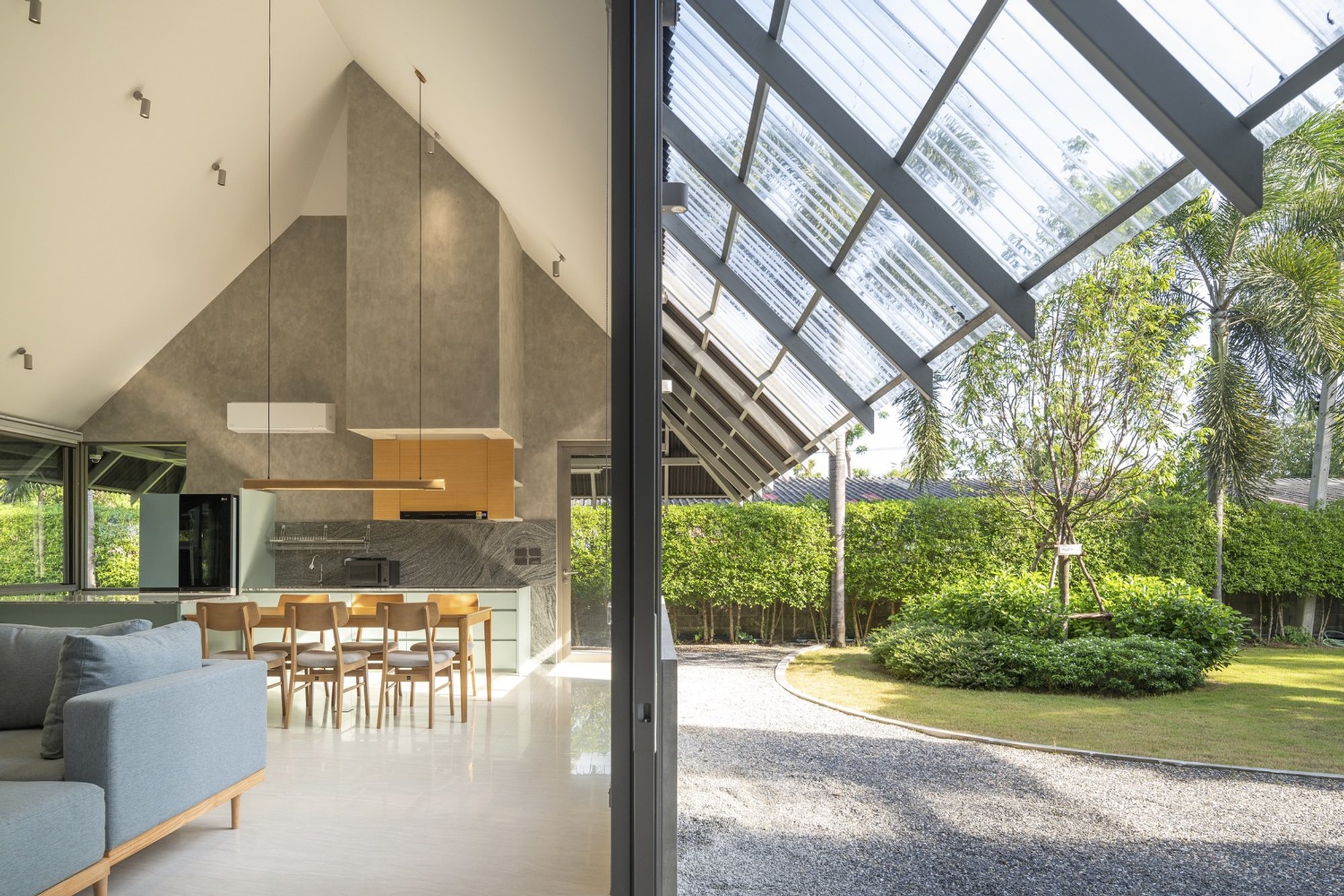 VYN Studio Wraps a Concrete L-Plan Around a Private Courtyard in Kanchanaburi