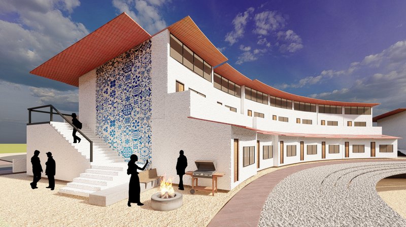 A view of the building's intricate facade with decorative tiles, highlighting community gathering spaces.