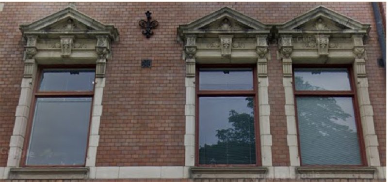 Ornate window facades retrieved and celebrated as elements of Stockholm's architectural identity.
