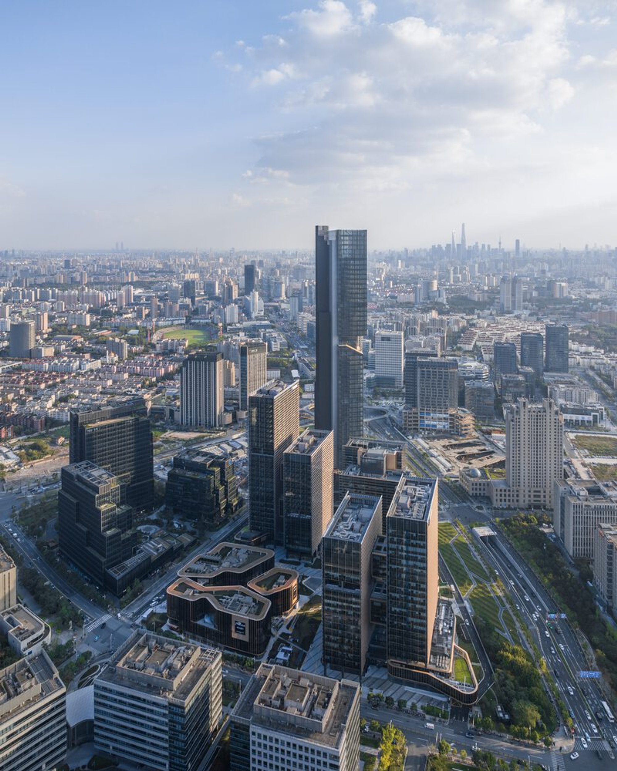 gmp Architects Wraps a Four-Tower Complex in Bronze Louvres for Shanghai's Springs District