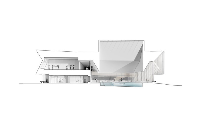 Section drawing revealing the double-height pool hall with angular roof and adjacent programmatic volumes