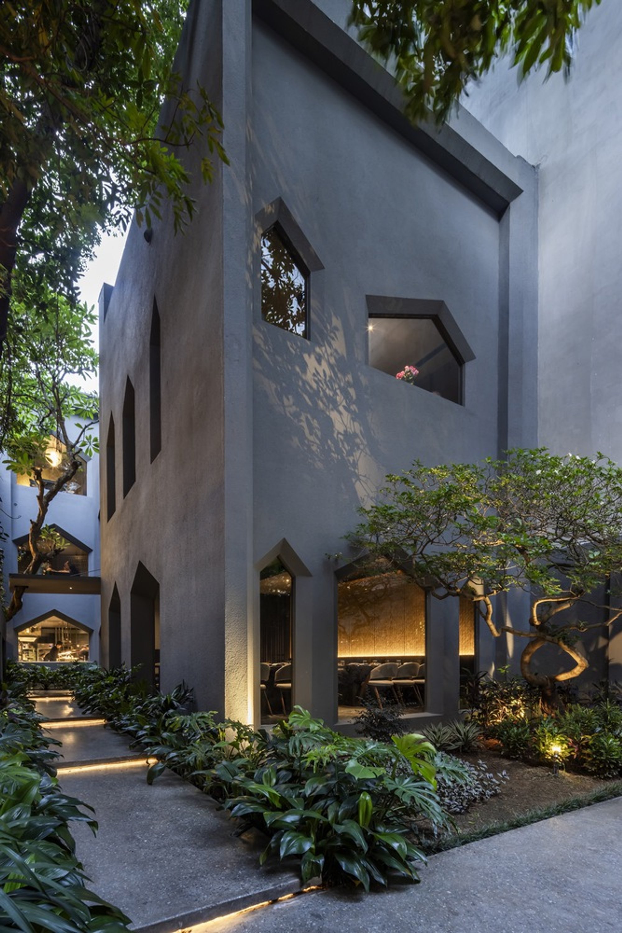 NH Village Architects Carves a Village of Crystalline Rooms into a Vietnamese Restaurant
