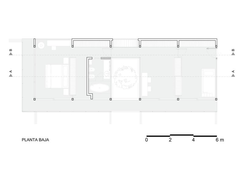 Floor plan drawing revealing a linear arrangement of rooms with courtyards and a central tree