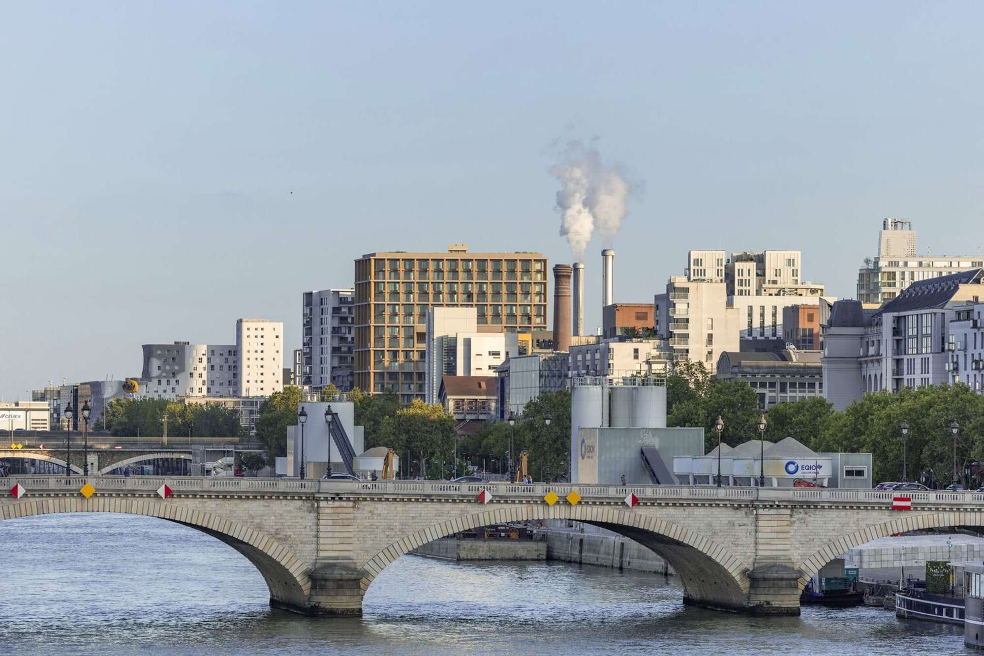 LAN Architecture Wraps a 50-Meter Timber Tower in Glass on the Banks of the Seine