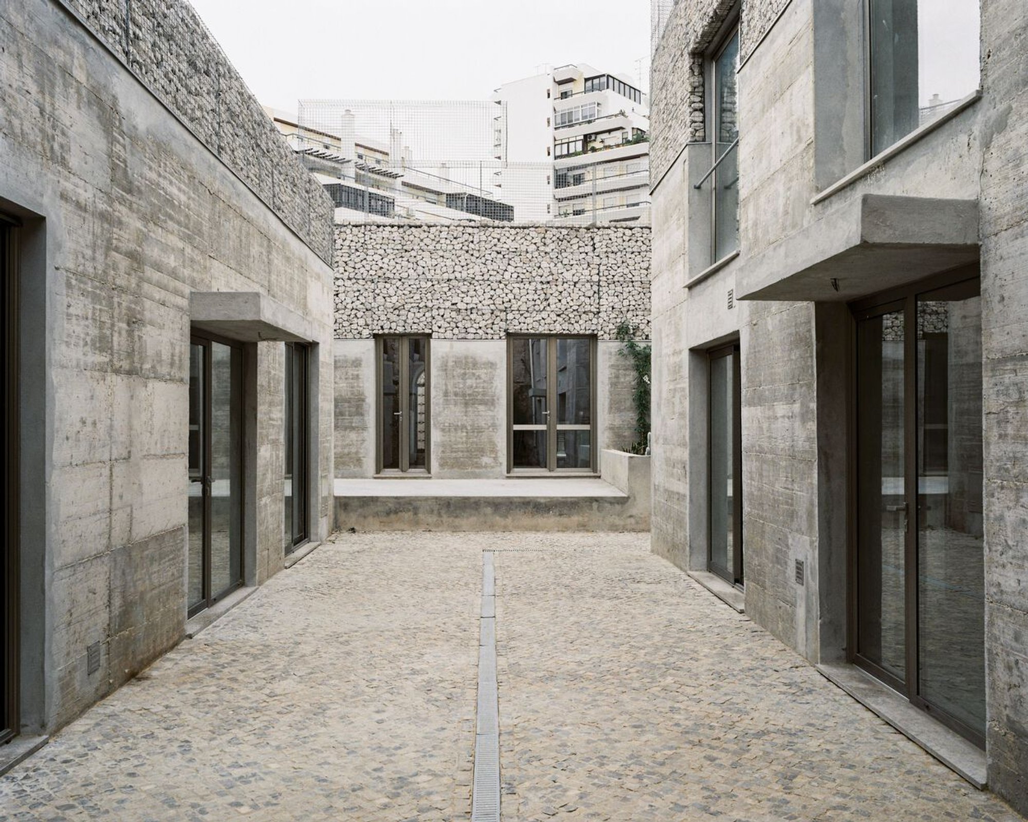 Three Exposed Concrete Façades by Corpo Atelier: A Contemporary Renovation in Faro, Portugal