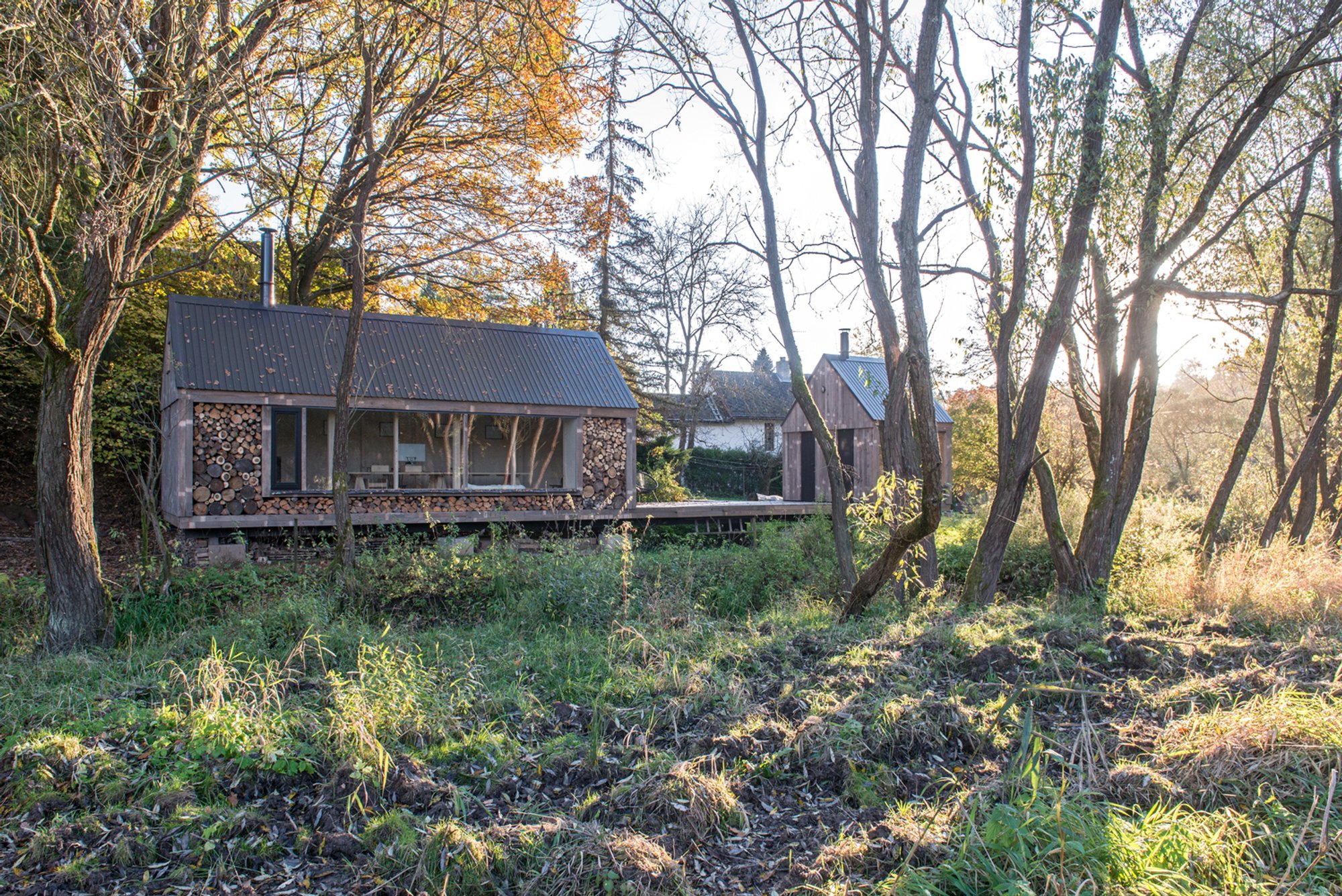 Jan Tyrpekl Builds a Firewood-Clad Atelier That Disappears into a Czech Meadow