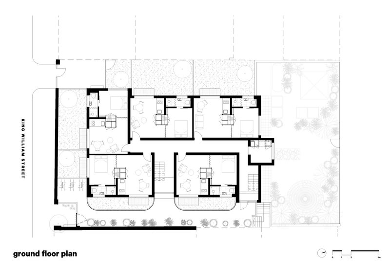 Ground floor plan showing multiple residential units with individual courtyards and street frontage to the left