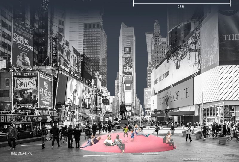 Times Square, NYC: The Mega Couch installation offers a soft, interactive space for relaxation amidst the bustling urban environment.
