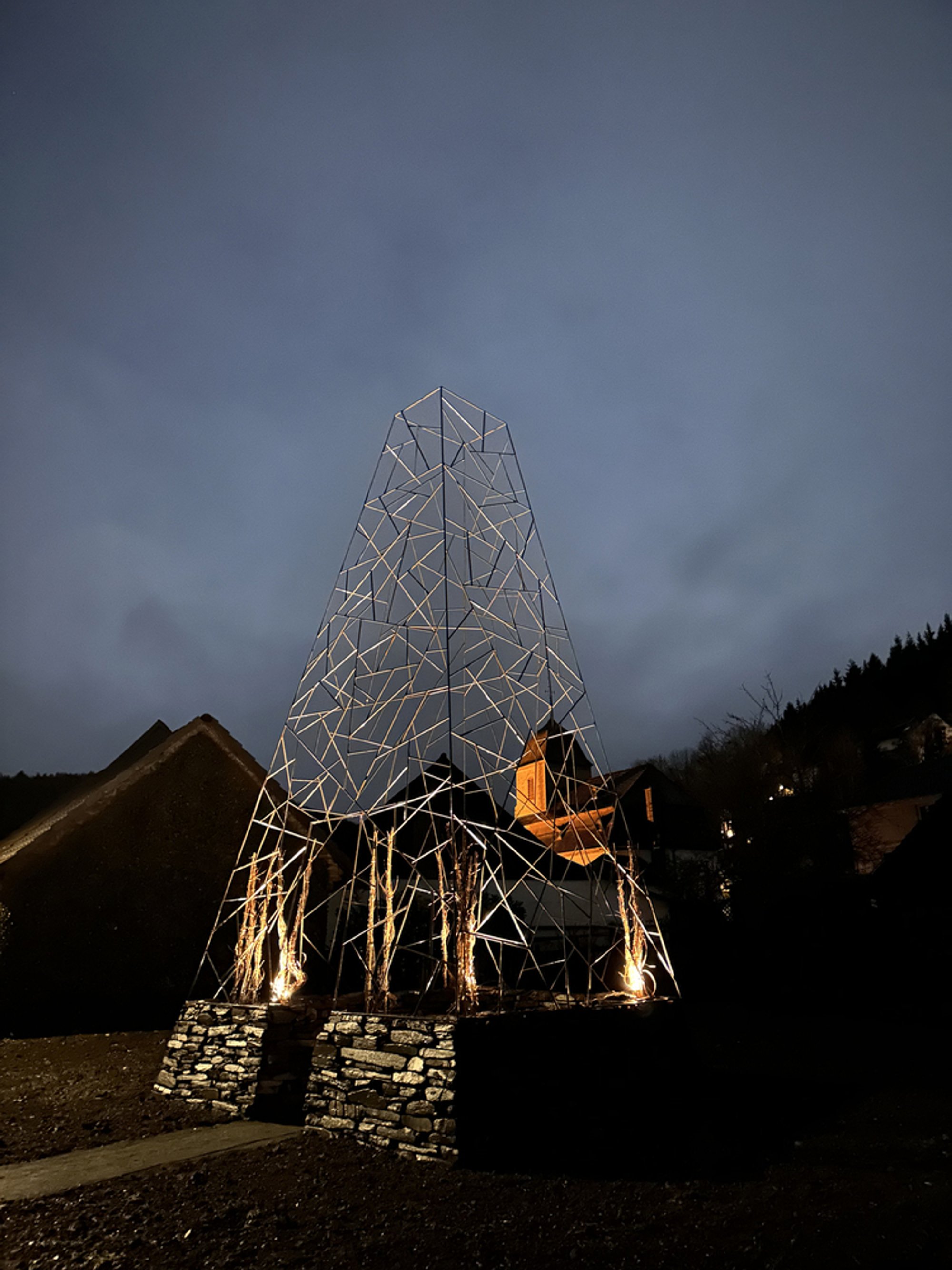 Christoph Hesse Architects Raises a Wireframe Tower from Dry-Stacked Slate in Rural Germany