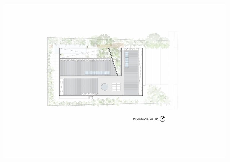 Site plan drawing showing rectangular building footprint with pool and surrounding vegetation