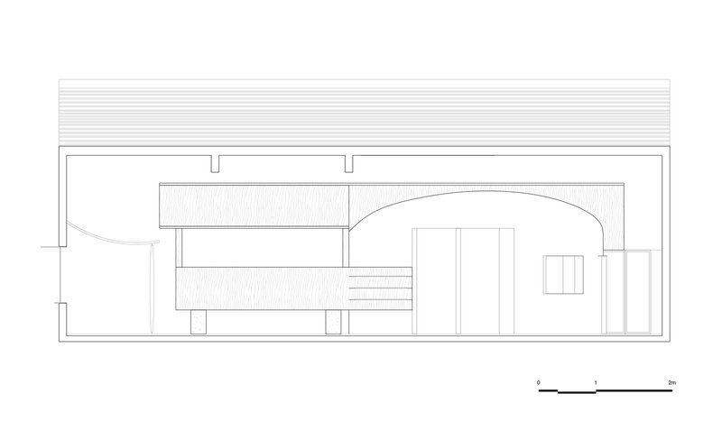 Section drawing showing interior spaces with a curved ceiling vault and staircase