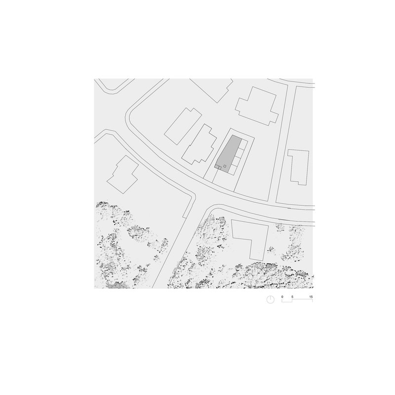 Site plan drawing showing the structure positioned among neighboring buildings and surrounding landscape