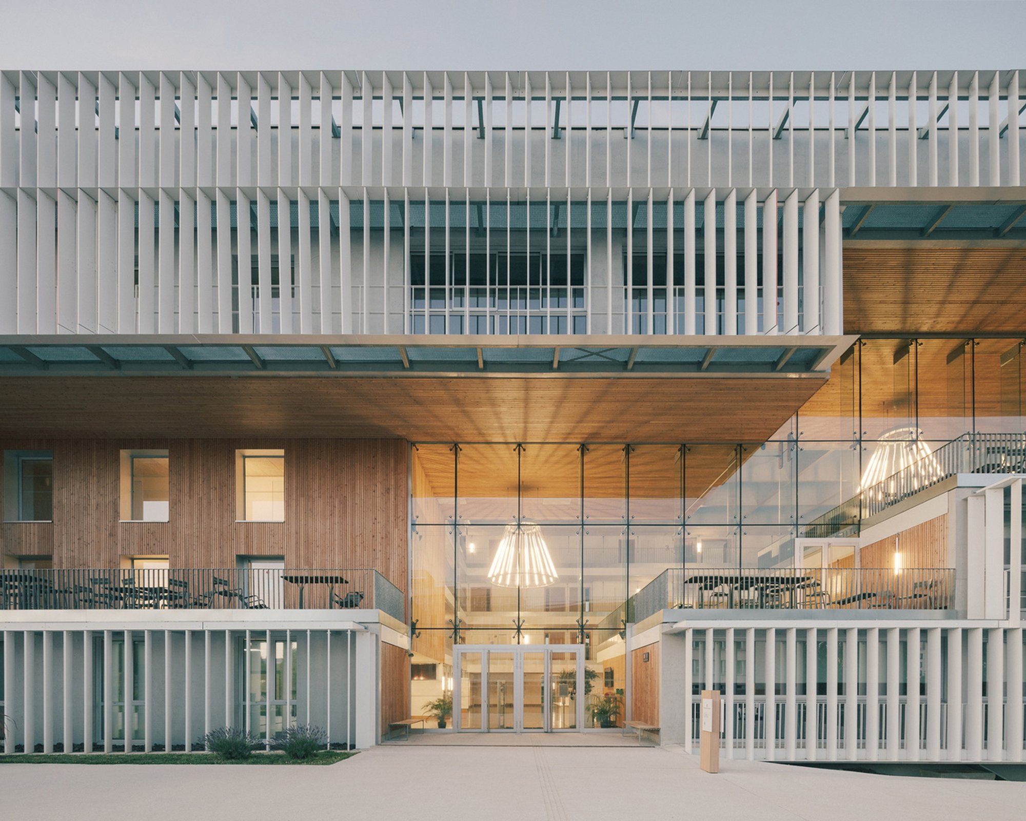 ValletdeMartinis Wraps a Compact Higher Education School in Pontoise with a Veil of White Louvers